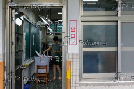 Voters cast their ballots in recall election for several Taiwanese legislators