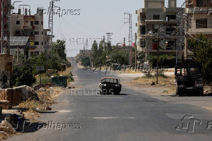 FILE PHOTO: Aftermath of deadly clashes between Druze fighters, Sunni Bedouin tribes and government forces, in Sweida