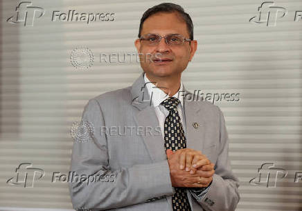 Reserve Bank of India (RBI) Governor Sanjay Malhotra arrives at a press conference in Mumbai