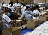 President Ferdinand Marcos visits a relief goods warehouse in Manila as Tropical Storm 'Crising apporaches