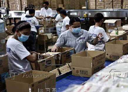 President Ferdinand Marcos visits a relief goods warehouse in Manila as Tropical Storm 'Crising apporaches