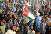 Supporters of Islamic organization Jamiat Ulema-e-Islam rally in Lahore in solidarity with Palestinians