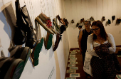 Relatives of missing persons attend an exhibition called 