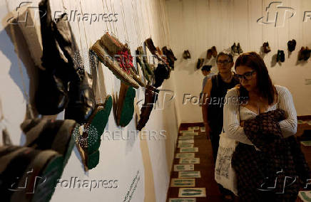 Relatives of missing persons attend an exhibition called