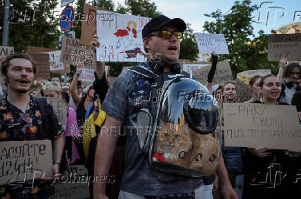 Ukrainians protest against a newly passed law, which curbs independence of anti-corruption institutions in Kyiv