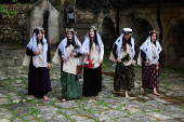 Iraqi Yazidis attend a ceremony on the occasion of Red Wednesday, to celebrate the Yazidi New Year, at Lalish temple in Shekhan District near Duhok province