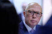 FILE PHOTO: Liberal Party leader Peter Dutton listens during a visit to youth mental health foundation in Western Sydney