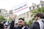 Rally against Islamophobia in Paris following man's stabbing in southern France mosque
