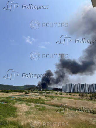 A general view shows smoke billowing after a South Korean navy maritime patrol aircraft crashed