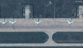 FILE PHOTO: A satellite image shows a group of TU 95 aircrafts before a drone strike, in Belaya airbase