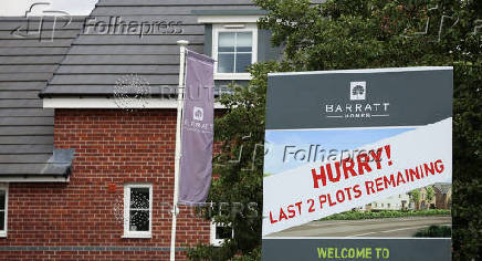 FILE PHOTO: Sign is seen outside a Barratt Homes housing development in Warrington, Britain