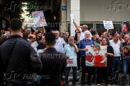 People take part in a protest against what organizers call 