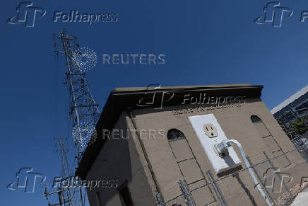 A giant electrical outlet is displayed at a PG&E substation building in Petaluma, California