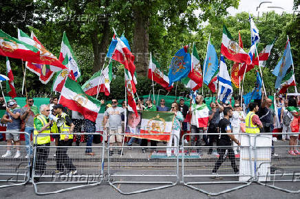 Supporters of Iran's exiled Crown Prince Reza Pahlavi and pro-Israel demonstrators gather outside the Iranian embassy during a protest in London