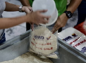 President Ferdinand Marcos visits a relief goods warehouse in Manila as Tropical Storm 'Crising apporaches