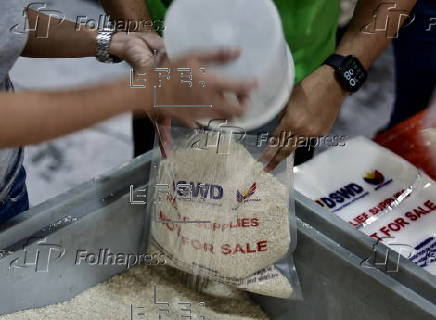 President Ferdinand Marcos visits a relief goods warehouse in Manila as Tropical Storm 'Crising apporaches
