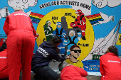 Greenpeace paints mural outside South Korea Embassy