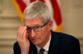 FILE PHOTO: Apple CEO Tim Cook participates in an American Workforce Policy Advisory Board meeting in the White House