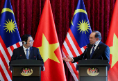 The Prime Minister of Vietnam meets his Malaysian counterpart during his visit to Malaysia