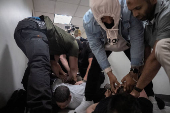 A migrant is detained by federal immigration officers at U.S. immigration court