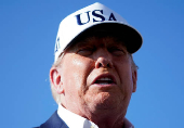 U.S. President Donald Trump speaks to members of the media upon his arrival at Morristown Airport