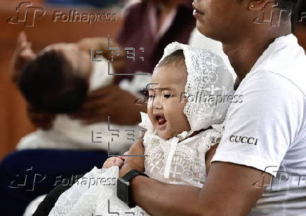 Mass baptism ceremony for children in Bacoor city