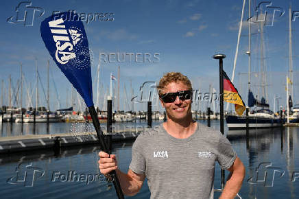 German stand-up paddler Michael Walther takes to the Baltic Sea for a test run in Kiel