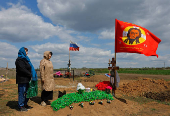 People visit a cemetery in Donetsk