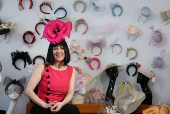 Milliner Merve Bayindir wears one of her hat creations as she speaks to Reuters ahead of the Ascot horse racing festival, in London