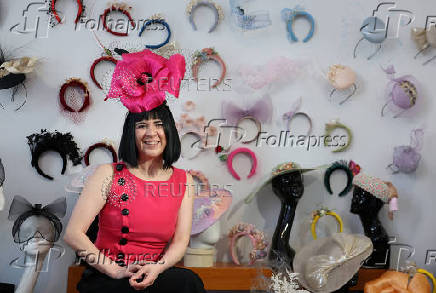 Milliner Merve Bayindir wears one of her hat creations as she speaks to Reuters ahead of the Ascot horse racing festival, in London