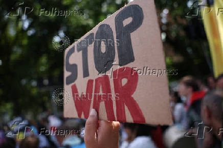 Demonstrators march against the upcoming NATO leaders' summit, at The Hague