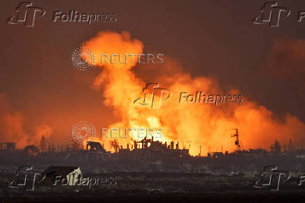An explosion in Gaza is seen from the Israeli side of the Israel-Gaza border