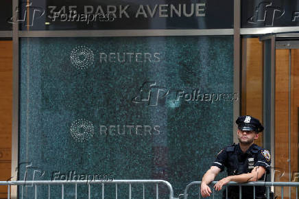 Police officers stand near the scene of a deadly mass shooting in Manhattan, in New York City