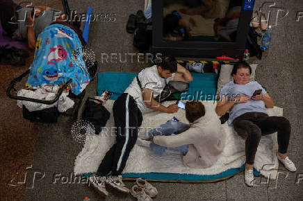 People take shelter inside a metro station during an air raid alert in Kyiv
