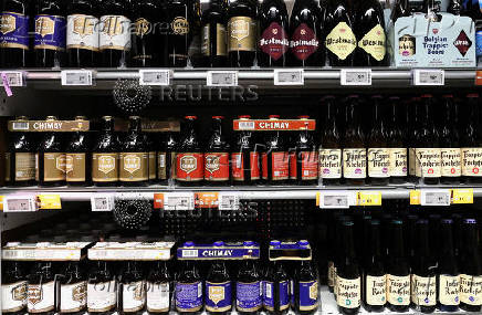 Bottles of Belgian beer are displayed for sale at a supermarket in Sint-Pieters-Leeuw