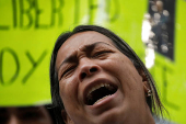 Family members of migrants imprisoned in El Salvador protest outside the United Nations building, in Caracas