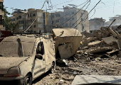 Debris lie at a damaged site in the aftermath of Israeli strikes, in Beirut's southern suburbs