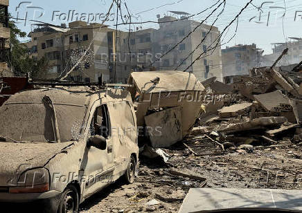 Debris lie at a damaged site in the aftermath of Israeli strikes, in Beirut's southern suburbs