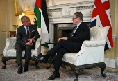 Britain's Prime Minister Keir Starmer and Jordan's King Abdullah sit down for a meeting inside 10 Downing Street, in London