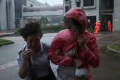 People brave strong winds as Typhoon Wipha approaches, in Hong Kong