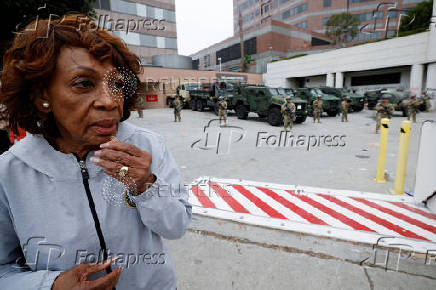 California National Guard troops stand outside the Edward R. Roybal federal building, in Los Angeles