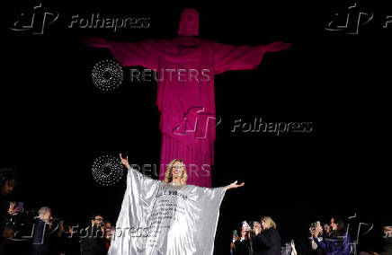 Models present creations by Alessa at the Christ the Redeemer statue to mark the launch of Rio Fashion Show, in Rio de Janeiro