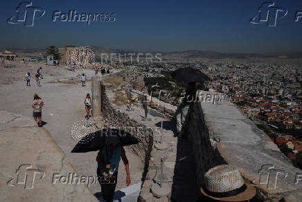 Tourists visit the Acropolis during a 3-days heatwave in Greece