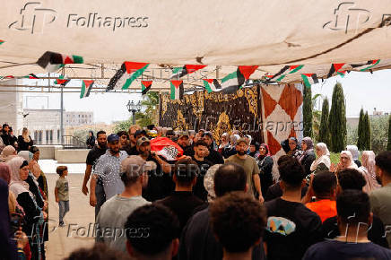Mourners take part in the funeral of of Sayfollah Kamel Musallet, killed amid the Israel-Gaza conflict, near Ramallah
