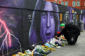 Fans pay tribute following the death of Ozzy Osbourne, in Birmingham