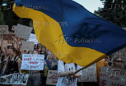 Ukrainians protest against a newly passed law, which curbs independence of anti-corruption institutions in Kyiv