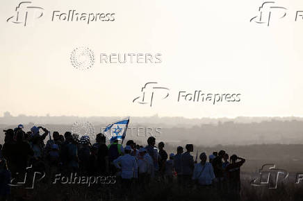 Israeli right wing activists take part in a rally organized by settlers groups to promote Israel's resettling in Gaza