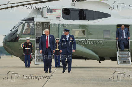 U.S. President Donald Trump boards Air Force One as he departs for New Jersey