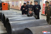 North Korea's leader Kim Jong Un visits a factory that makes shells and machinery