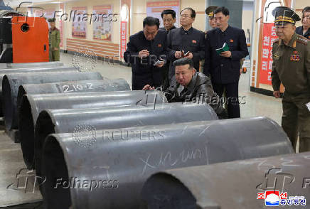 North Korea's leader Kim Jong Un visits a factory that makes shells and machinery